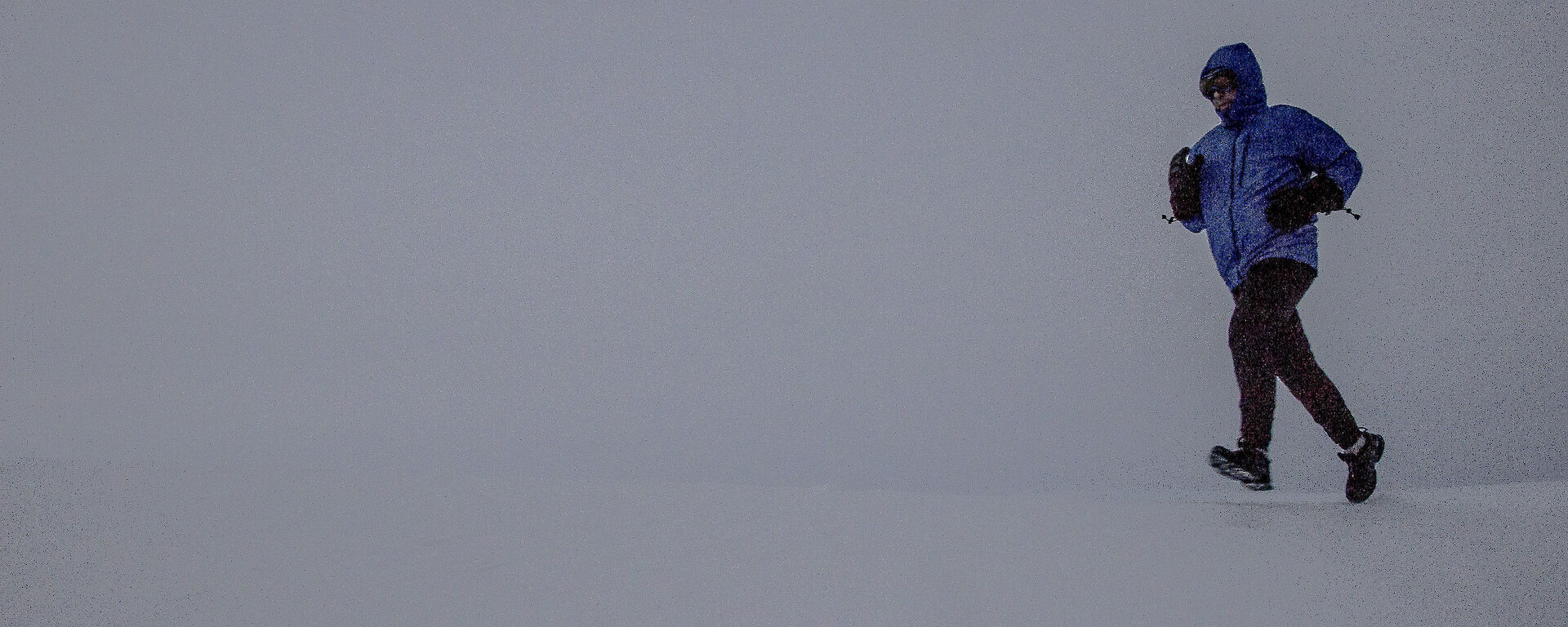 A man running in the snow