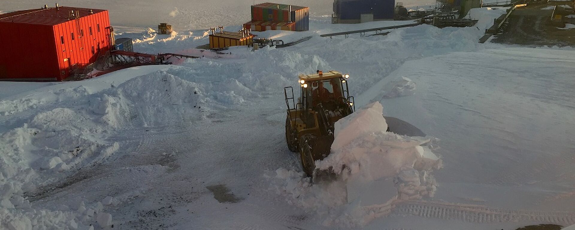 Heavy equipment moving snow