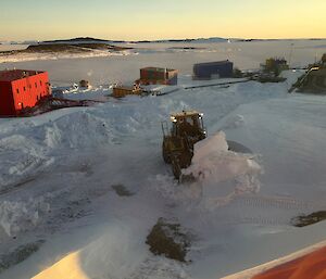 Heavy equipment moving snow