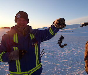 A man with a small fish