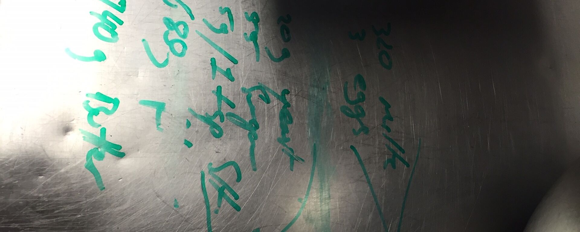 a recipe written on a stainless steel bench