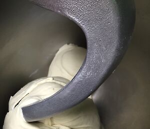 a mixing bowl full of dough