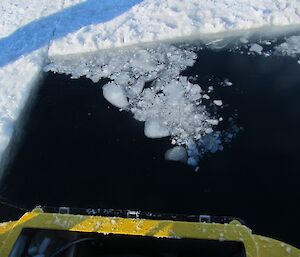 An edge of an ice ramp cut into the sea ice
