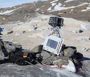 A solar powered camera on top of a hill ready to take photos of snow petrels