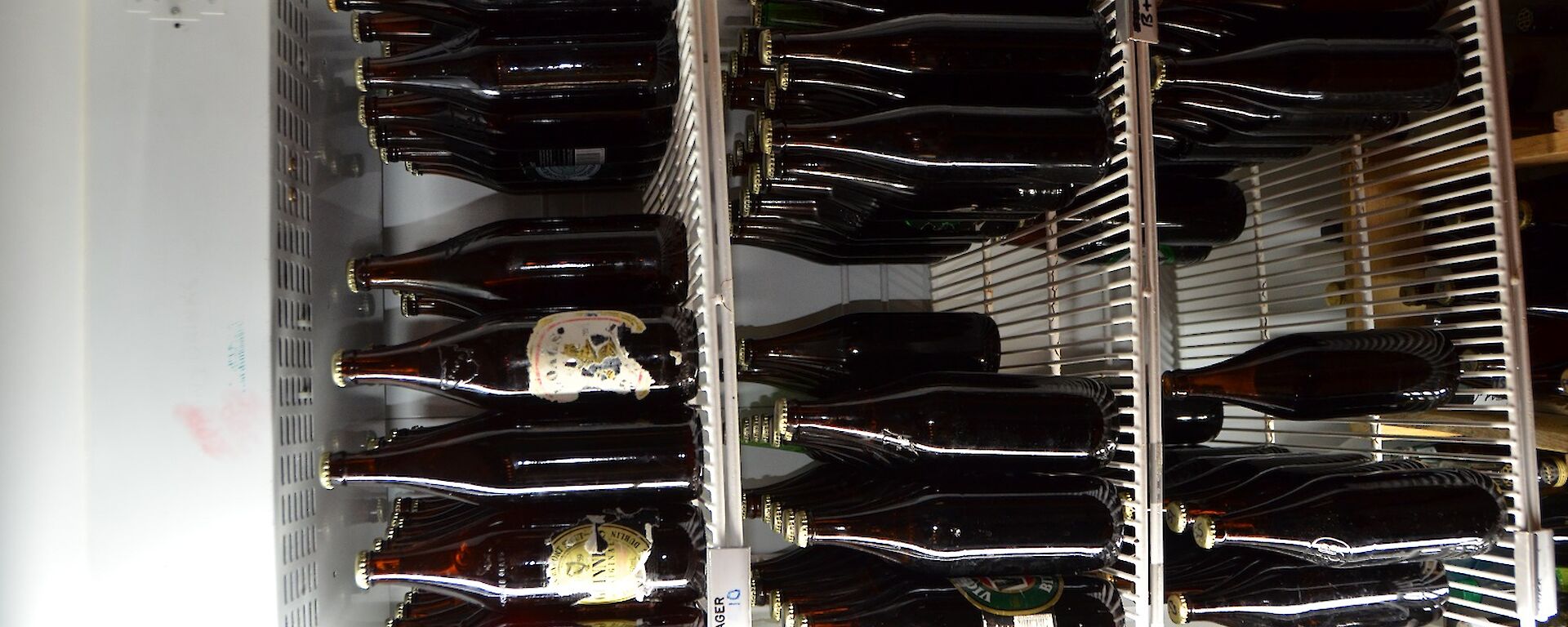 A fridge full of beer bottles
