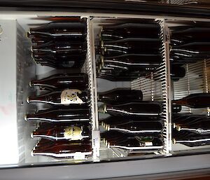 A fridge full of beer bottles