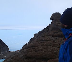 A man at the rocky top of a mountain