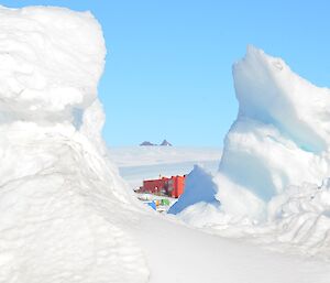 A view of the station with large piles of ice in the foreground
