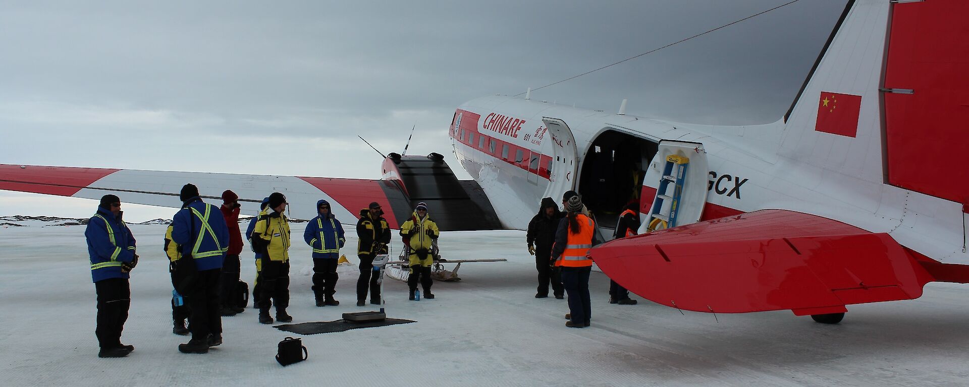 Expeditioners on the sea ice at Davis SLA preparing to board the Xueying bound for Mawson