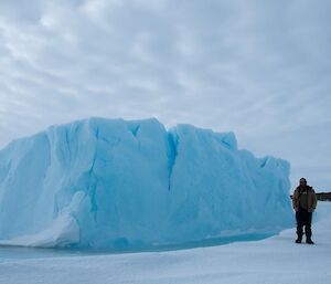 Ben Newport in front of one of the magnificent icebergs frozen in the sea ice near Mawson