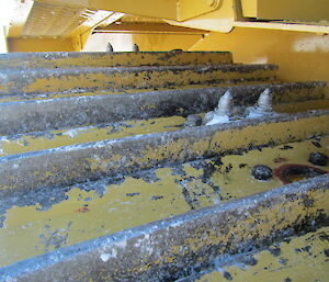 Spikes added to the dozer tracks to also chop up the slippery ice surface