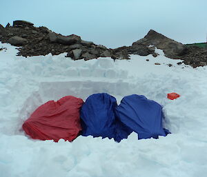 Three expeditioners in their bivvies for survival training