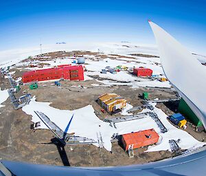 A view of Mawson station in the sunshine from the top of one of the wind turbines