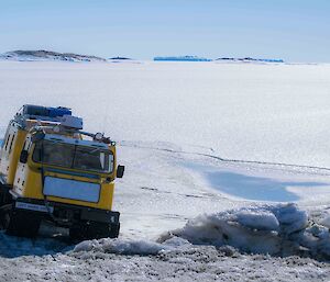 The yellow Hägglunds just about to come back on station from the sea ice