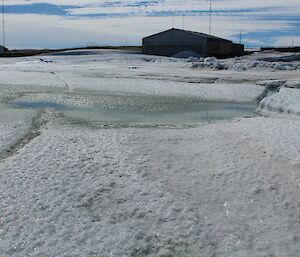 A picture of deteriorating Horseshoe Hrbour sea ice in front of the station