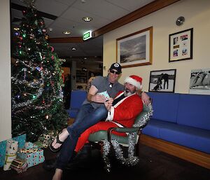 The first expeditioner getting his present from Santa at Mawson 2016