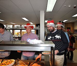 Expeditioners lining up at the servery for Christmas Dinner Mawson 2016