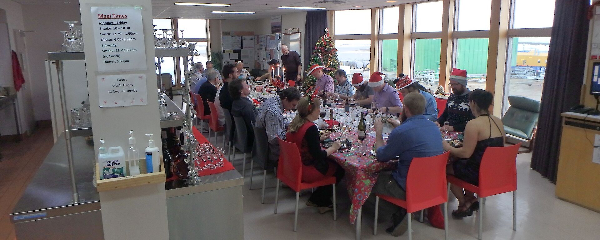 Mawson expeditioners sitting down for Christmas Dinner 2016
