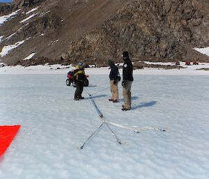 Two expeditioners pull the rope through the pulley system to recover the quad