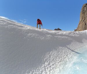 Jason Burgers cutting steps with an ice axe