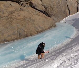 Ali Dean cutting steps out of a wind scoop