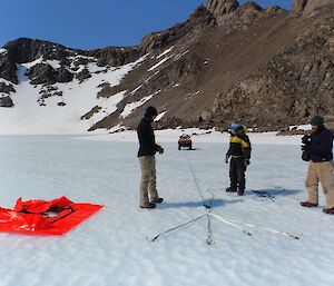 Setting up anchors and rope in the ice to recover a quad correctly under Heidi Godfrey’s instruction