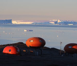 The Bécherviase Island research huts with icebergs in the background