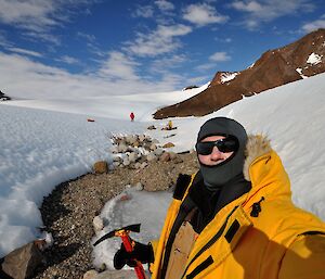 A man takes a photo of himself at Patterned Lake