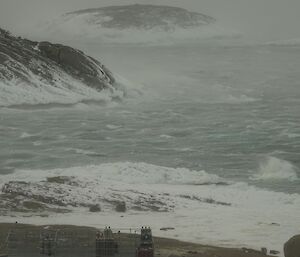water and waves being blown by high winds in a grey peninsula of islands