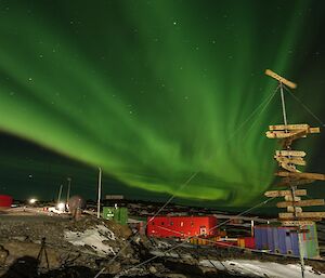 A green aurora behind Mawson station