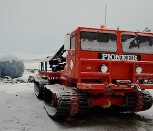 The red pioneer is covered in snow