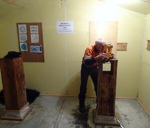 A man stands in front of technical equipment