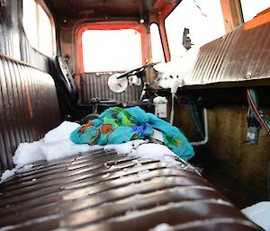 A blue scarf sits on a truck bench seat