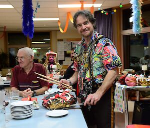 A man cuts a birthday cake