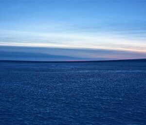 A frozen expanse of blue ice.