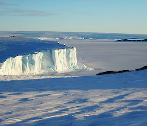 An icy plateau and frozen sea ice.