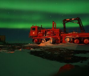 Bands of green above a red truck.