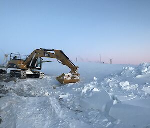 A bulldozer is clearing snow.