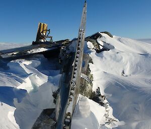 The remnants of a plane wreck embedded in snow and ice