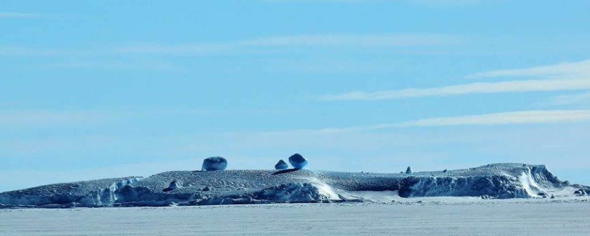 Geometric ice formations resting on an ice covered island