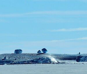Geometric ice formations resting on an ice covered island