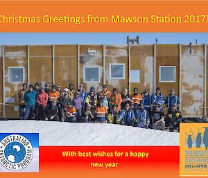 A group of 27 people stand in front of a brown building. The photo is set in a Christmas greeting card