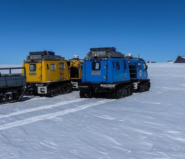 2 Hägglunds travelling over the plateau towards the mountains.