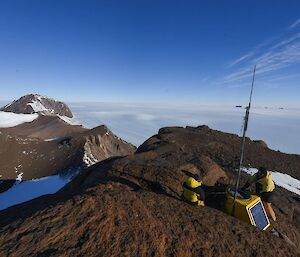 2 men on a mountain overlooking the ice plateau