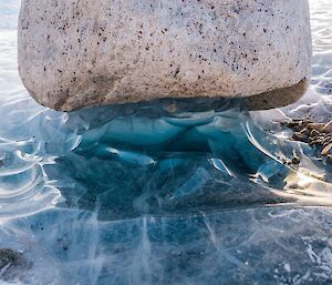 Ice formations around a rock