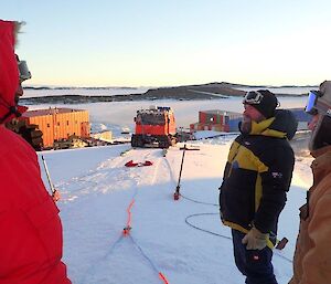 Hagg in the background with the rescue equipment laid out in front with 3 people standing in foreground