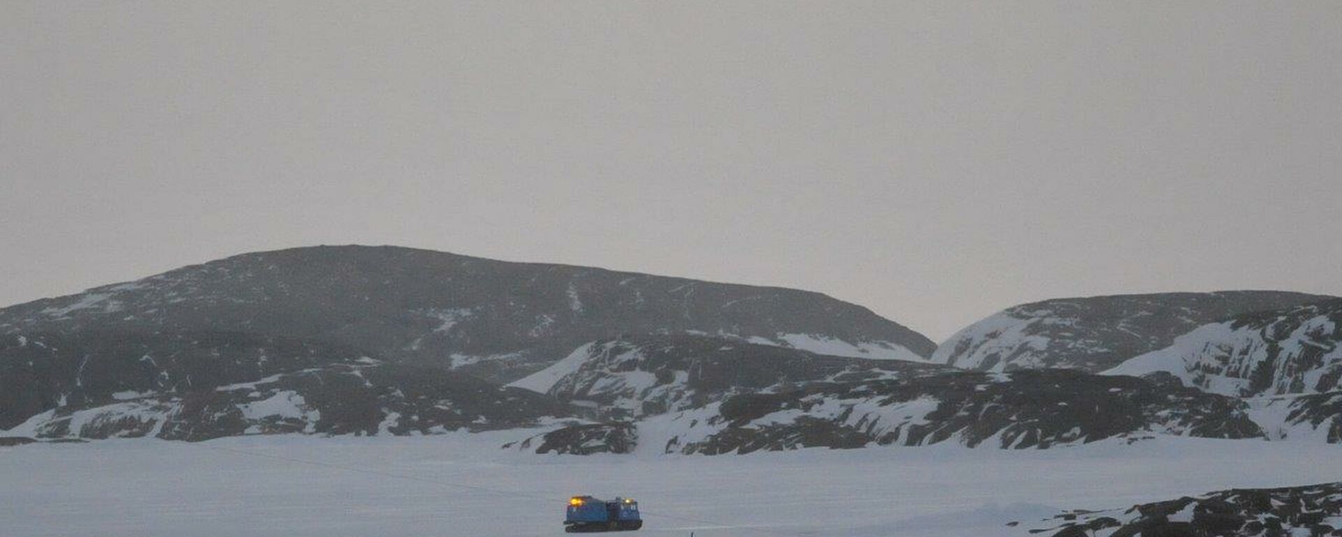 Blue hagg heads out on to the sea ice to prove the Macey route within the Station Operating Area