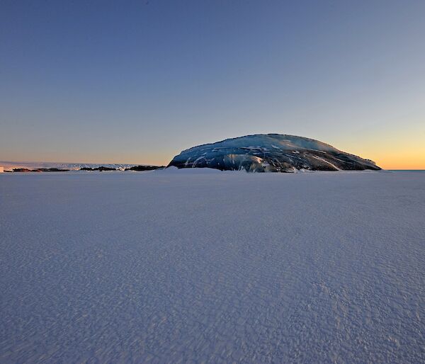 Jade iceberg in the frozen ocean