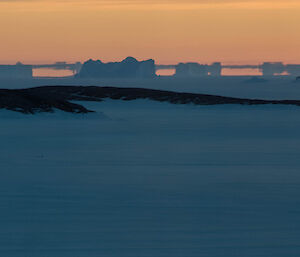 Fata morgana on the horizon multiplies the usual number of icebergs