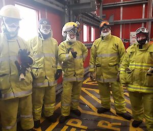 A group of people in fire fighting clothing